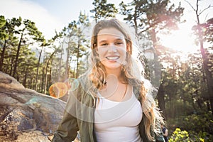 Young happy jogger looking at camera