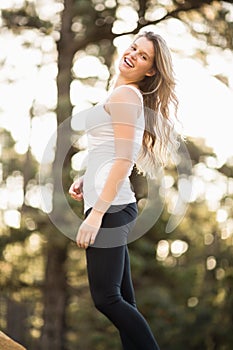 Young happy jogger looking at the camera