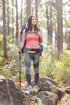 Young happy jogger looking at something in the distance