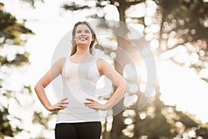 Young happy jogger looking at something in the distance