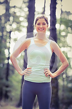 Young happy jogger standing