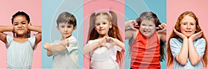 Young and happy kids gesturing isolated on multicolored studio background. Human emotions, facial expression concept