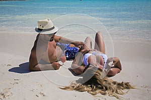 Young happy lovers on romantic travel honeymoon having fun on vacation summer holidays romance.