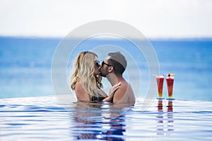 Young happy lovers on romantic travel honeymoon having fun on vacation summer holidays romance.