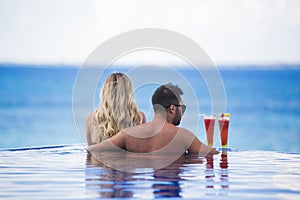 Young happy lovers on romantic travel honeymoon having fun on vacation summer holidays romance.