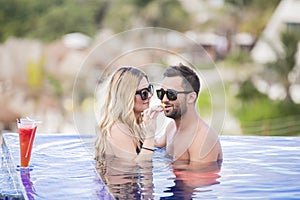 Young happy lovers on romantic travel honeymoon having fun on vacation summer holidays romance.