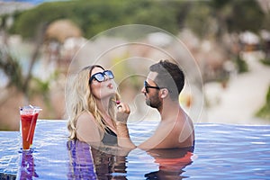 Young happy lovers on romantic travel honeymoon having fun on vacation summer holidays romance.