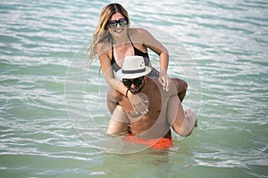 Young happy lovers on romantic travel honeymoon having fun on vacation summer holidays romance.