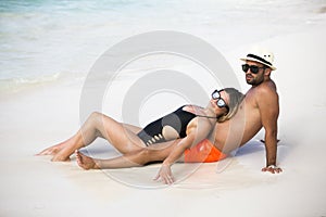 Young happy lovers on romantic travel honeymoon having fun on vacation summer holidays romance.