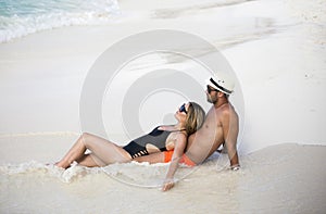 Young happy lovers on romantic travel honeymoon having fun on vacation summer holidays romance.