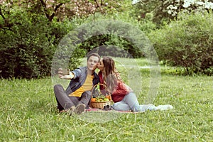 Young, happy, loving couple having date in the park. Relations, friendship and love.