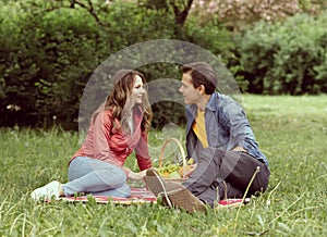 Young, happy, loving couple having date in the park. Relations, friendship and love.