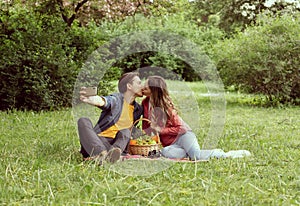 Young, happy, loving couple having date in the park. Relations, friendship and love.