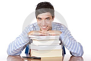 Young happy male student with study books