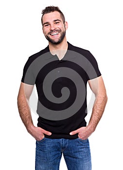 Young happy man in a black polo shirt photo