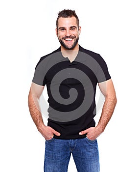 Young happy man in a black polo shirt photo