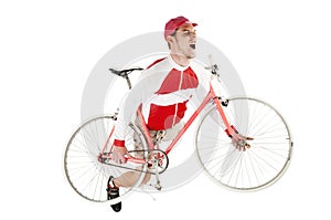 Young happy man holding his bike posing as playing