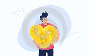 Young happy man hugging heavy three golden symbols of bitcoin