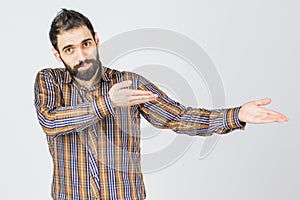 Young happy man portrait confident businessman showing a present