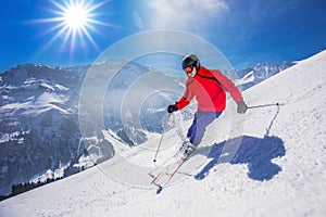 Young happy man skiing in Lenzerheide ski resort, Switzerland. photo