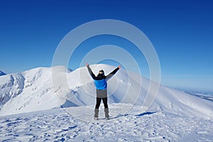 Young happy man at the top of Kopa Kondracka during winter, Zakopane, Tatry mountains, Poland