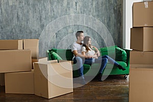 Young happy millennial couple students move into their first new owners home. Simple white background of urban apartment