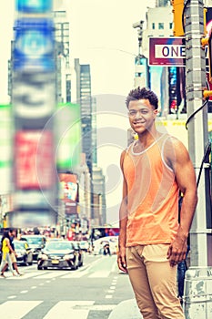 Young Happy Mix Race American Man traveling in New York City in hot summer photo