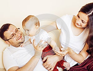 Young happy modern family smiling together at home. lifestyle people concept, father holding baby son