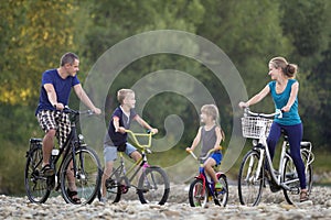 Young happy mother, father and two cute blond children, boy and