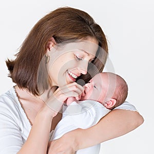 Young happy mother holding her newborn baby