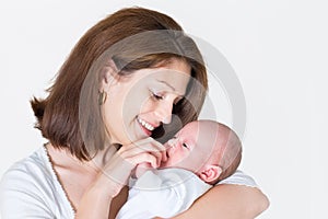 Young happy mother holding her newborn baby