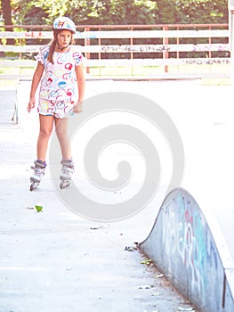 Young happy skater trying exciting outdoor activity