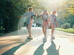 Young happy skaters outdoors photo