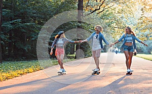 Young happy skaters on vacation