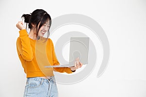 Young happy smiling Asian woman laughing with friends online