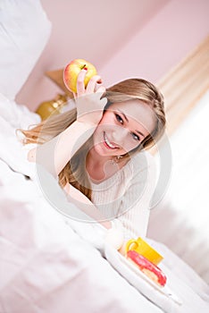 Young happy smiling coquette girl in lingerie