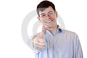 Young happy smiling handsome man shows thumb up