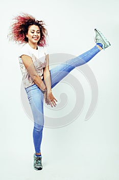 Young happy smiling latin american teenage girl emotional posing jumping on white background, lifestyle people concept