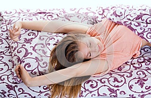 Young happy smiling woman waking up