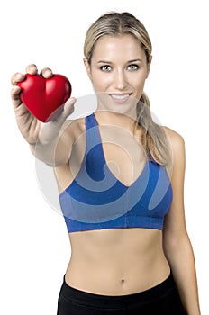 Young happy sporty girl showing heart