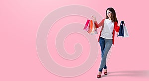 Young happy summer shopping woman with shopping bags