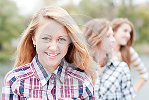 Young happy teen girl with friends