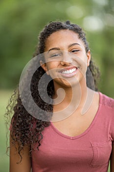 Young happy teen girl laughing and smiling.