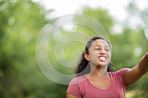 Young happy teen girl laughing and smiling.