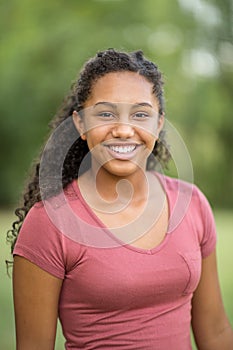 Young happy teen girl laughing and smiling.