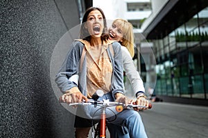 Young happy tourists women sightseeing in city on vacation