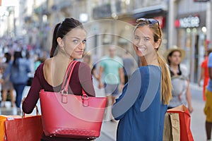 Young happy and wealthy women shopping