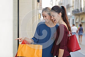 Young happy and wealthy women shopping