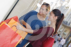 Young happy and wealthy women shopping