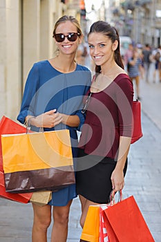 Young happy and wealthy women shopping